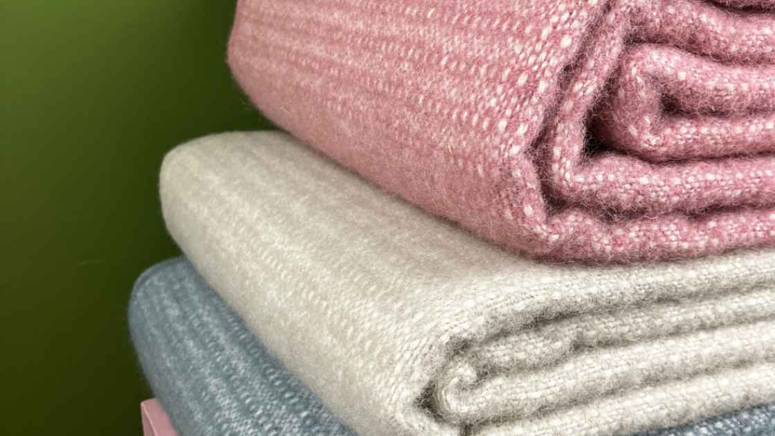 Swedish eco lambswool throws on a bench