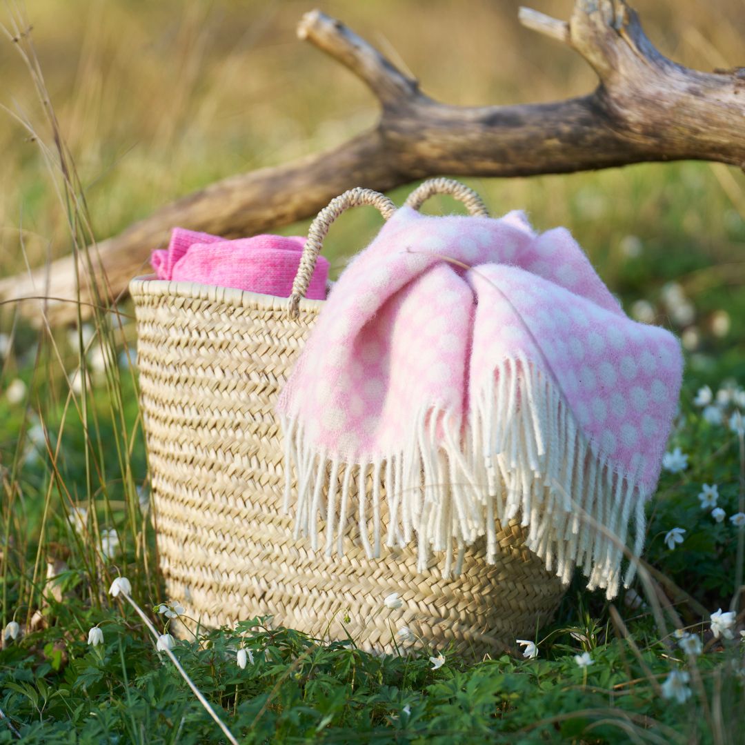 Pink wool throws in a basket
