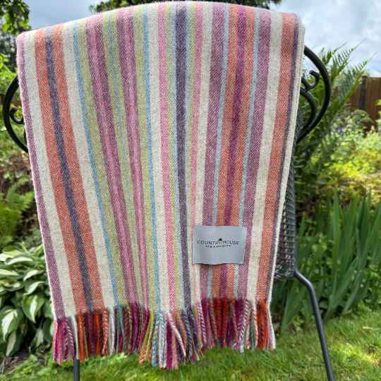 santa cruz stripe merino wool blanket on a chiar