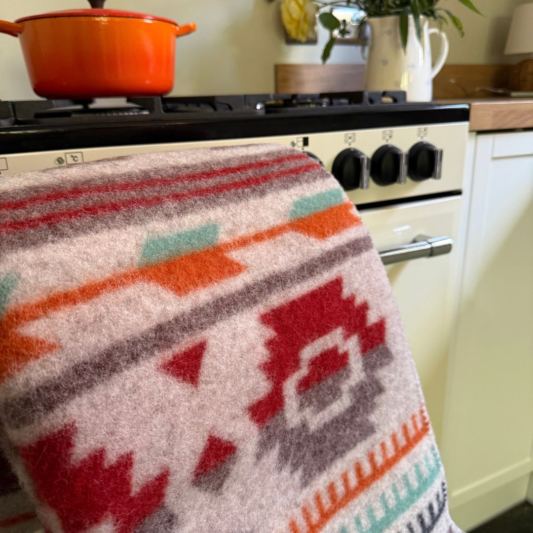 multi coloured wool blanket on a chair in a kitchen 