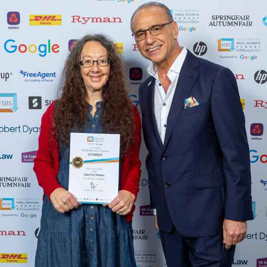 Networking Gold: Helen Lloyd Connects with Theo Paphitis at SBS2024