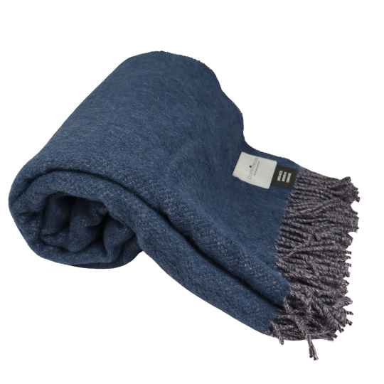 Folded blue blanket with tassels on a white background