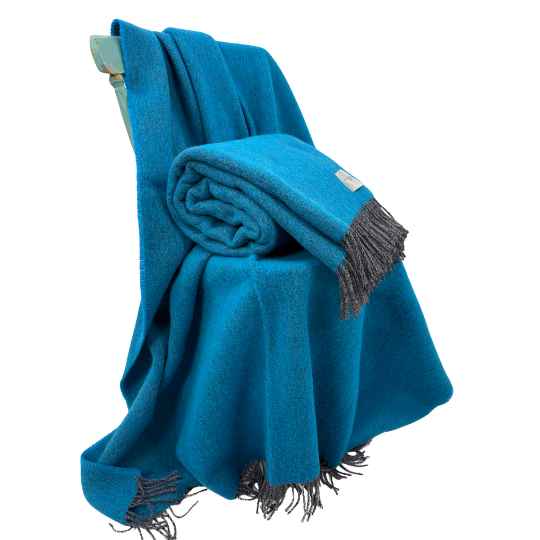 cornflower Blue wool blanket with fringes on a white background
