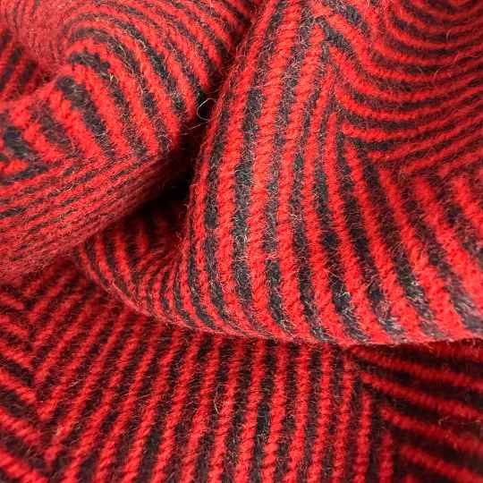 Close-up of red and black striped wool throw 