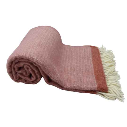 harald dusty rose pink lambswool throw rolled up