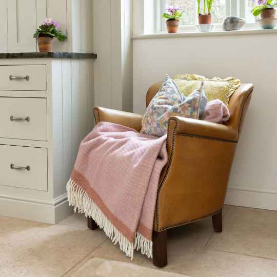 Dusty rose on a leather armchair
