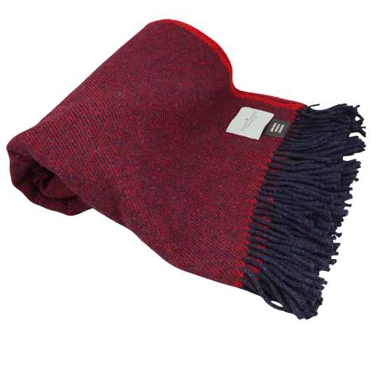 hedgerow red recycled wool throw rolled up on a white background