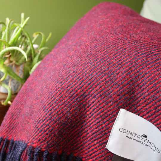 hedrow red wool throw with a woven country mouse label with a plant