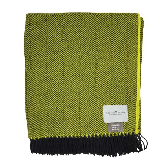 Yellow and black herringbone patterned throw blanket with a brand label on a white background