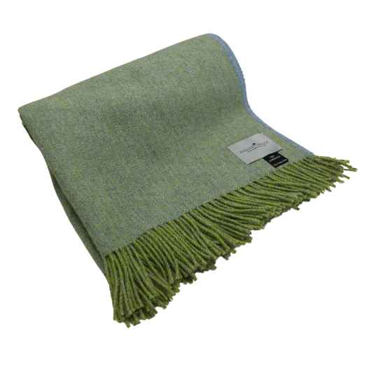 light sage green herringbone wool throw rolled up