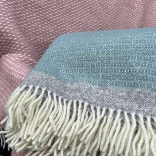 Harald dusty blue wool throw with a complimentary pink wool throw 