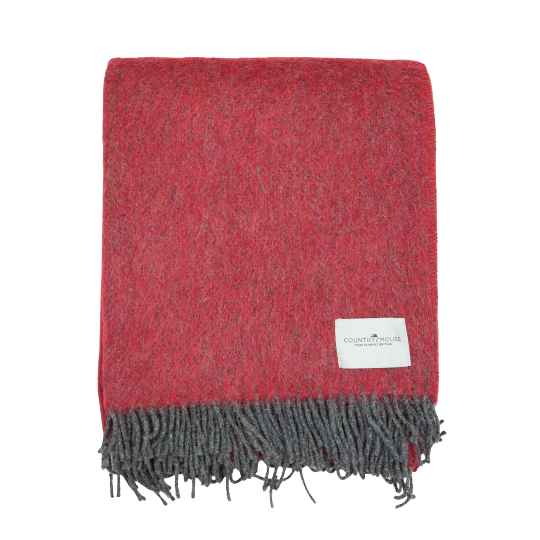 raspberry pink wool throw on a white background
