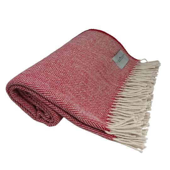 Red and white herringbone patterned wool throw blanket with fringes on a white background