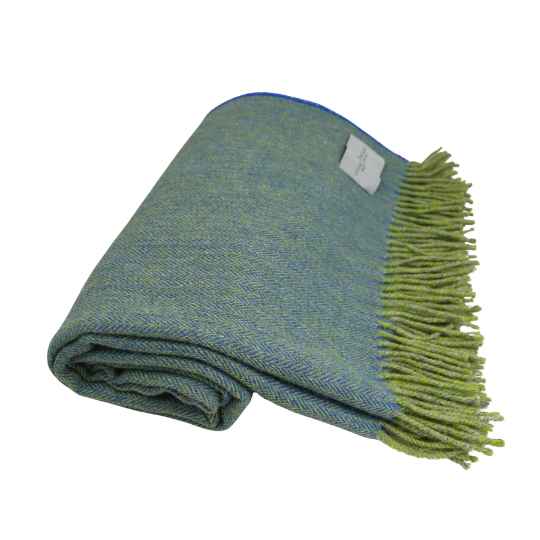 folded sky blue and lime wool throw shoeing fringe on a white backround