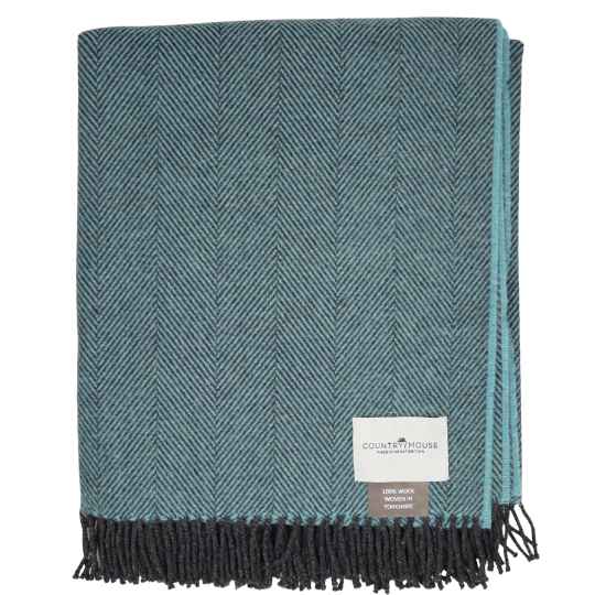 blue and black herringbone patterned throw blanket with a brand label on a white background