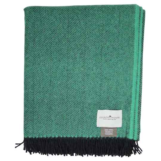 spruce green wool throw with a country mouse label