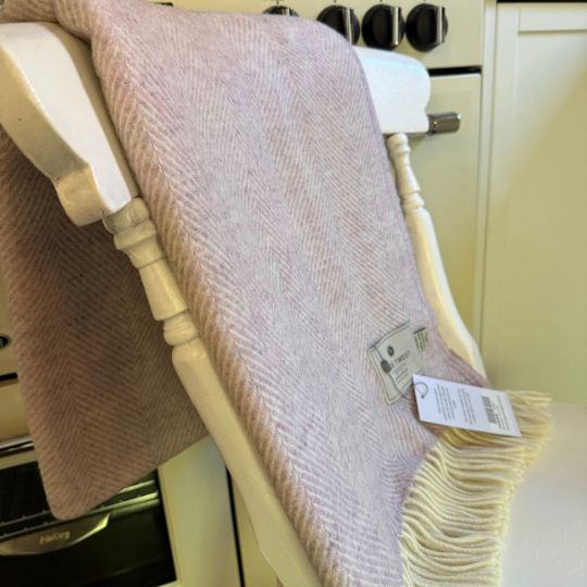 sugared almond wool throw on a chair in a kitchen