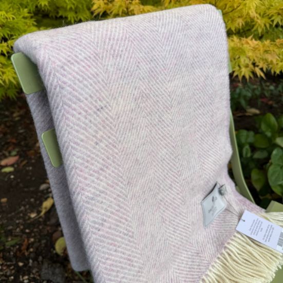 sugared almond wool  throw on a chair in a garden