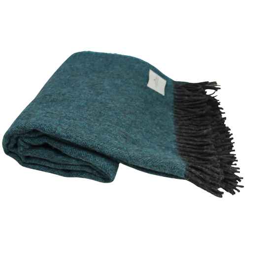 Teal blanket with black fringe on a white background