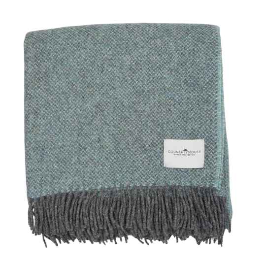 blue and grey wool throw on a white background