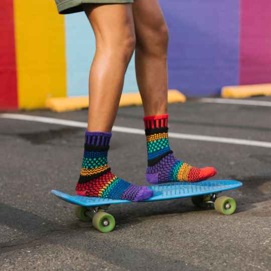 Gemstone solmate socks shown on a skateboard
